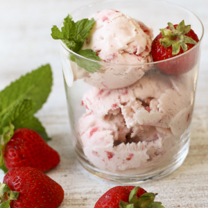 This sophisticated homemade strawberry ice cream is laced with a splash of balsamic vinegar reduction and a sprinkling of freshly ground pepper.