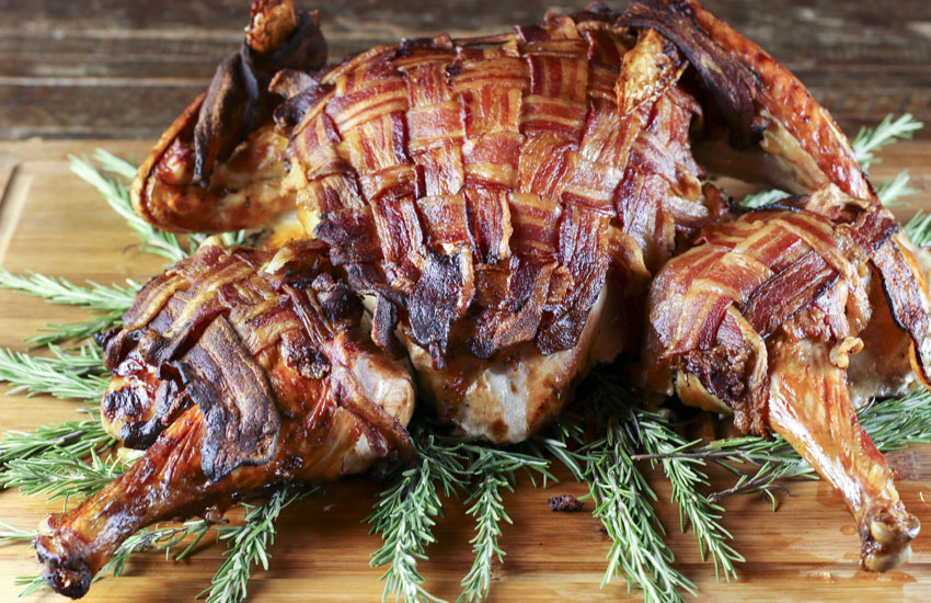Bacon-wrapped spatchcocked turkey is the most beautiful, tasty and moist turkey you will ever make and it roasts in just 80 minutes.