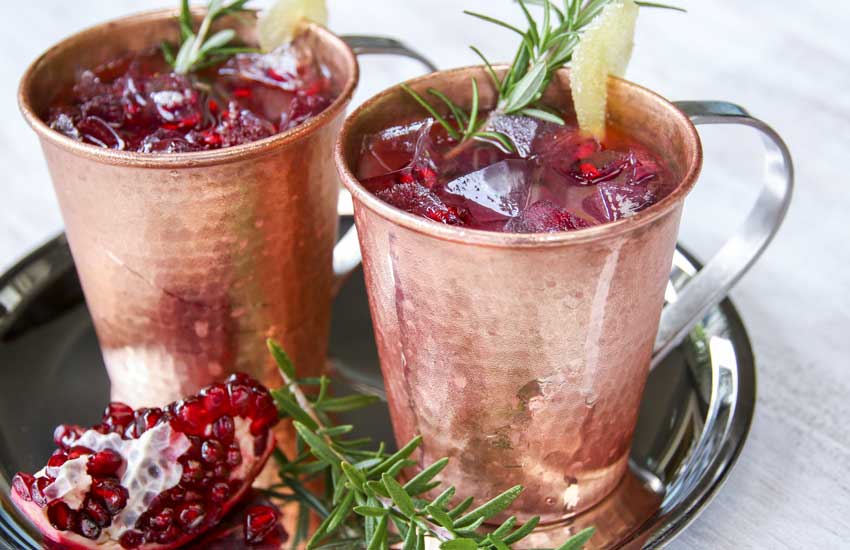 A festive Pomegranate Moscow Mule made with Pama Pomegranate Liqueur is just the thing for celebrating the winter holidays.