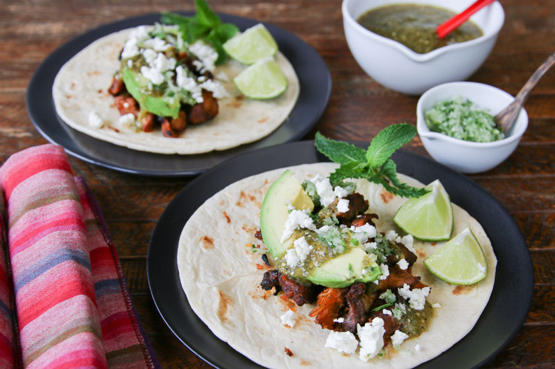 Easy, lip-smacking good, homemade, no lard, no Coca Cola, healthy carnitas are paired with a 3-ingredient minted tomatillo sauce.
