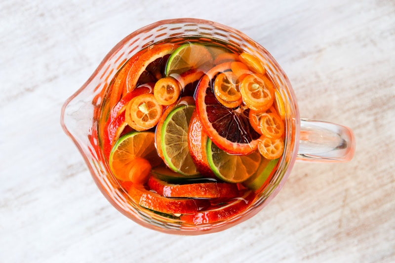 A light, citrusy, refreshing and vibrant orange sangria that is perfect for kicking off the summer at your next barbecue or picnic on the beach.