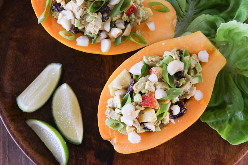 Chilled papaya halves are filled with a curried chicken salad filled with dried cherries and diced apples. Topped with chopped macadamia nuts, this salad is the perfect hot weather meal.